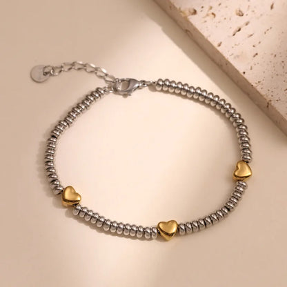 Βραχιόλι ατσάλι με χρυσές καρδιές-BR118