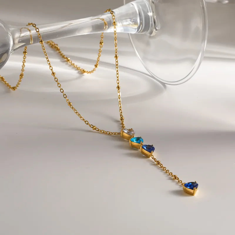 Steel necklace with blue zircon hearts - NE193