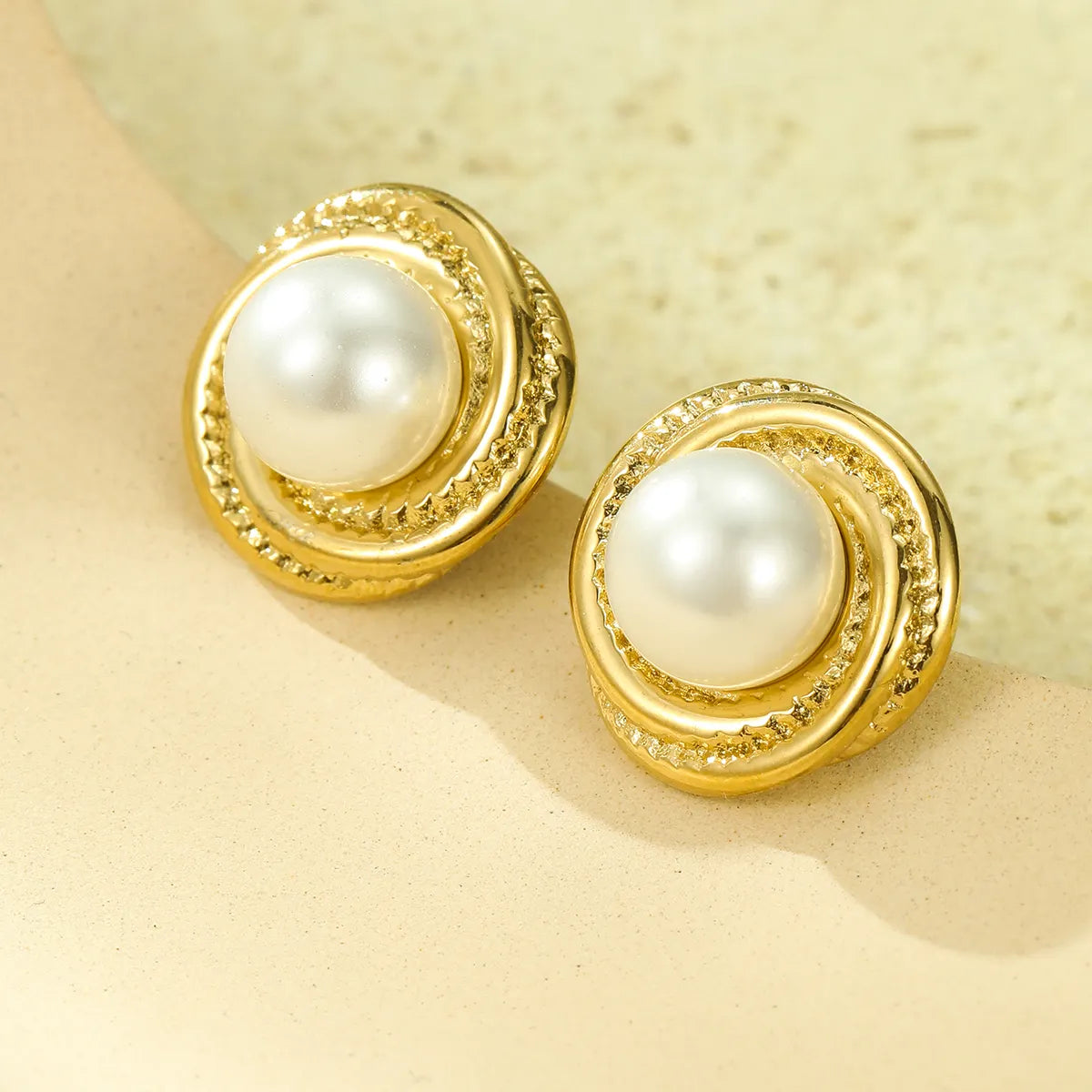 Earrings gold steel with spiral and pearl-ea316