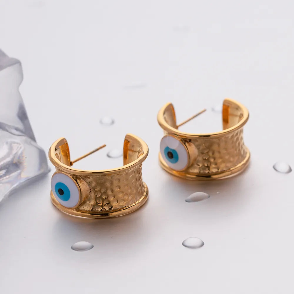 Boucles d'oreilles créoles avec oeil -EA353