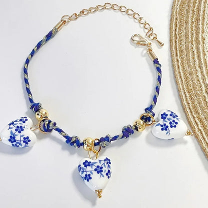 Steel bracelet with white flowers - BR255