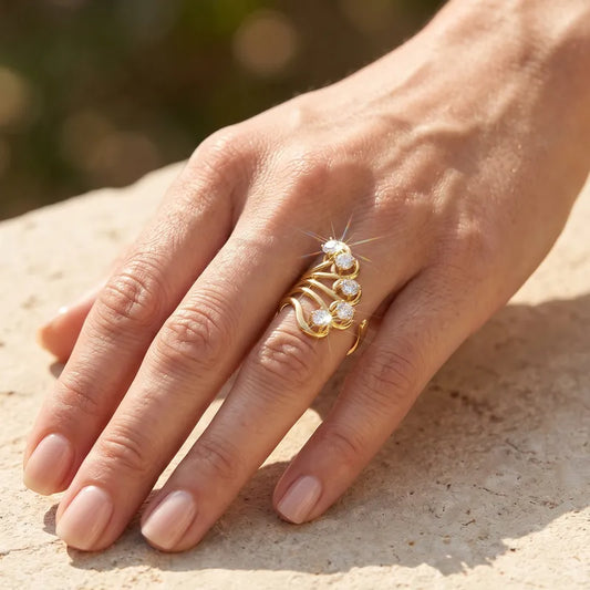 Anillo abanico de acero dorado con circonitas - R022
