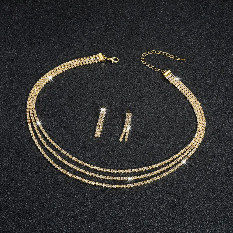 Conjunto triple collar y pendientes de strass dorados - set025