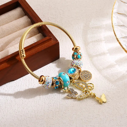 Brățară din oțel auriu cu fluture și talismane-BR488