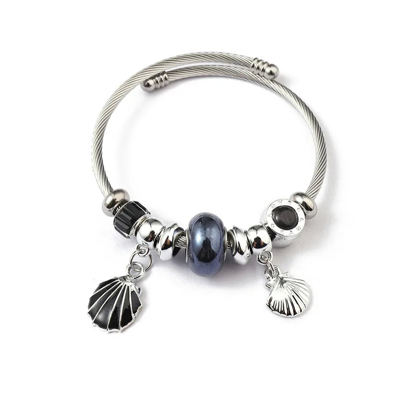 Βραχιόλι ατσάλινο bangle με μαύρα charms και κοχύλι -BR391
