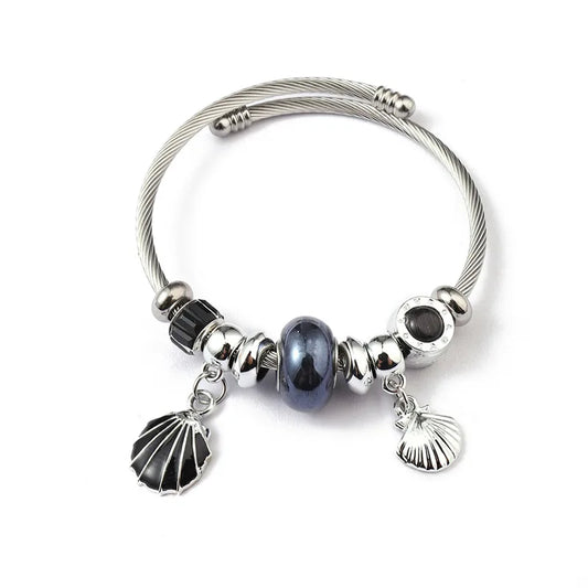 Βραχιόλι ατσάλινο bangle με μαύρα charms και κοχύλι -BR391