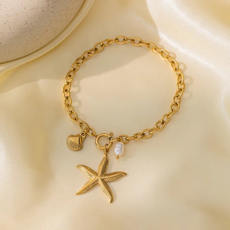 Βραχιόλι επιχρυσωμένο ατσάλι με αστερία και κοχύλι - BR415