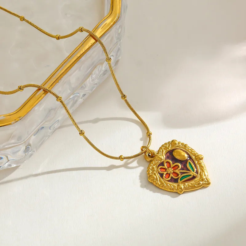 *Κολιέ επιχρυσωμένο ατσάλι καρδιά με λουλούδι-NE047