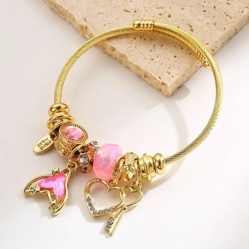 Βραχιόλι επιχρυσωμένο ατσάλι με zircon και ροζ charms-BR357