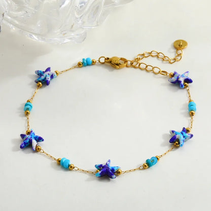 Βραχιόλι επιχρυσωμένο ατσάλι με μπλε αστερίες - BR511