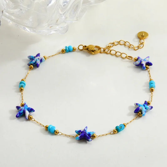 Βραχιόλι επιχρυσωμένο ατσάλι με μπλε αστερίες - BR511