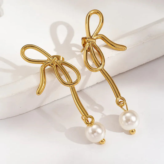 Σκουλαρίκια χρυσό ατσάλι φιόγκος με πέρλα-EA653