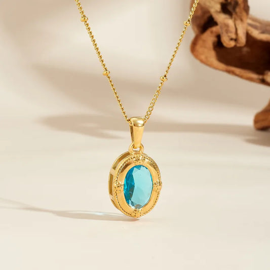 Collier acier doré avec cristal rouge - NE737