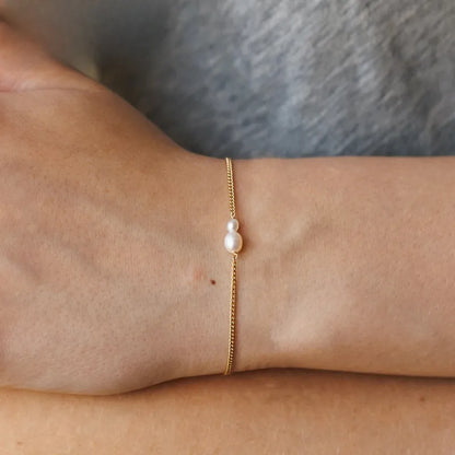 Βραχιόλι επιχρυσωμένο ατσάλινο λεπτό με πέρλα-BR304