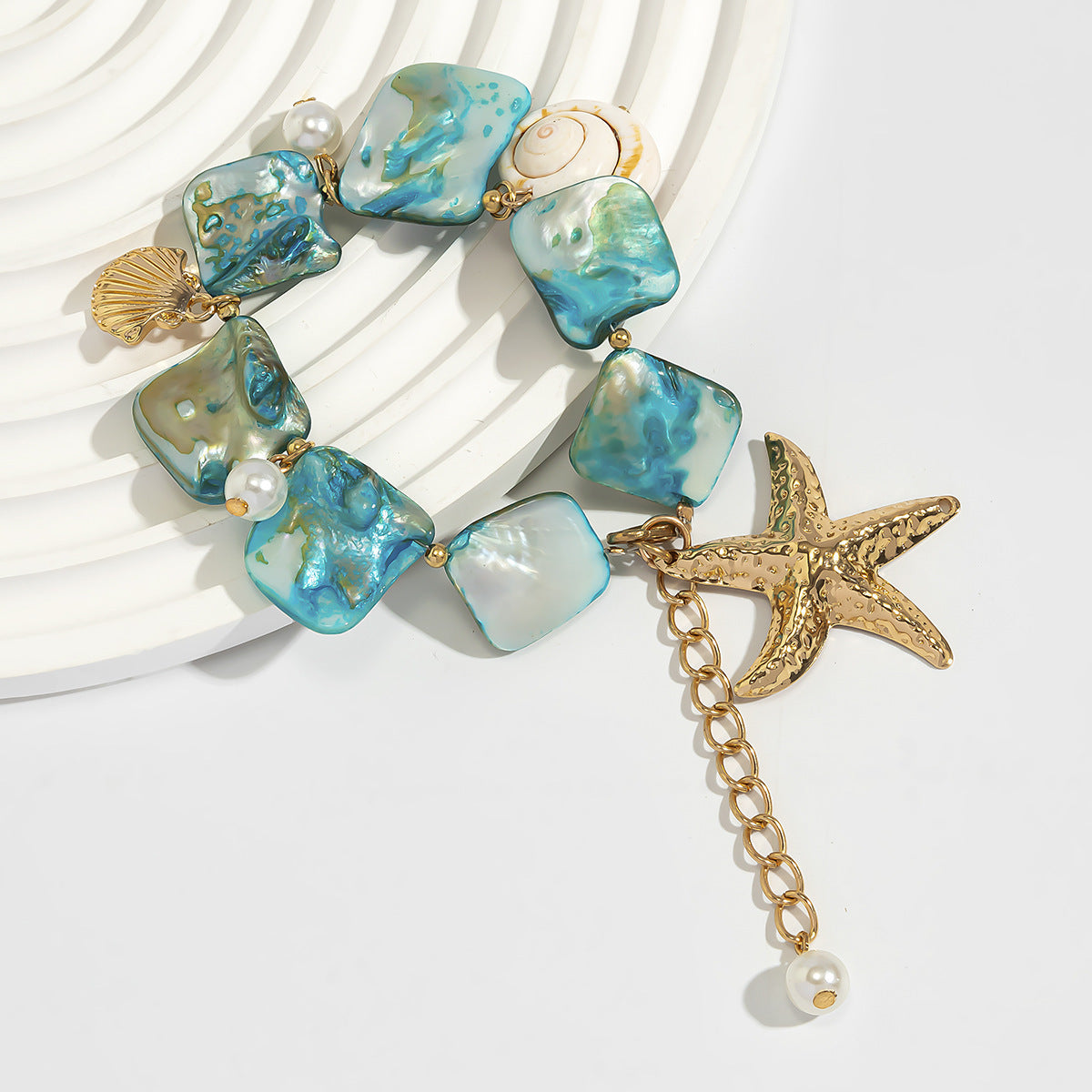 Bracelet from alloy and blue shells