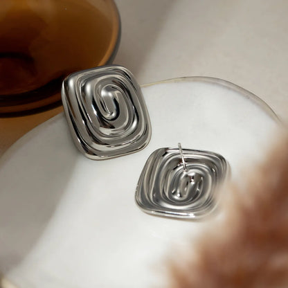 Earrings of steel squares with spiral-ea162