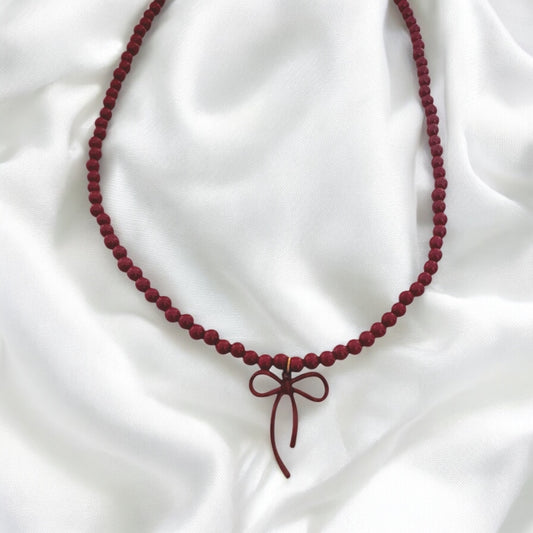 Necklace with steel chain, acrylic crimson beads and pendant booty-ne086