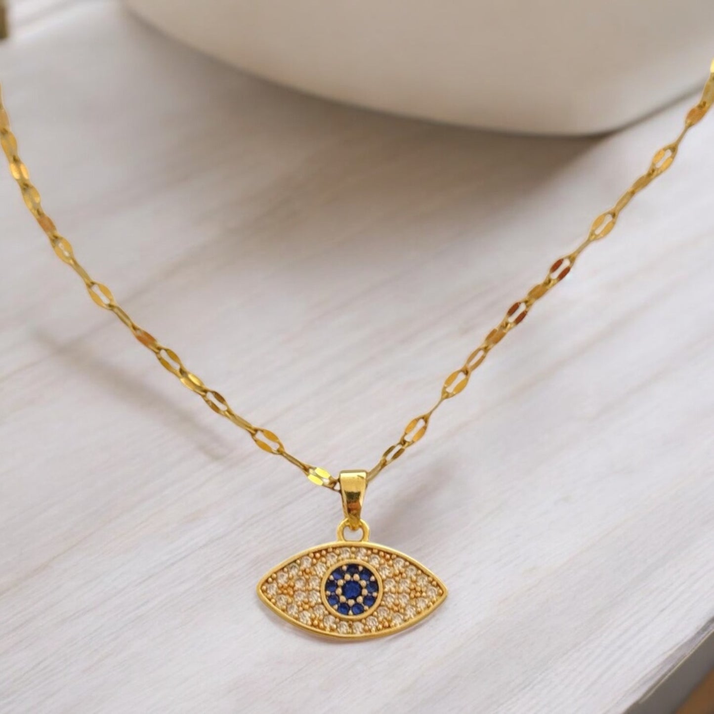 Steel necklace with pendant eye gold full of little zircon white and blue - ne027