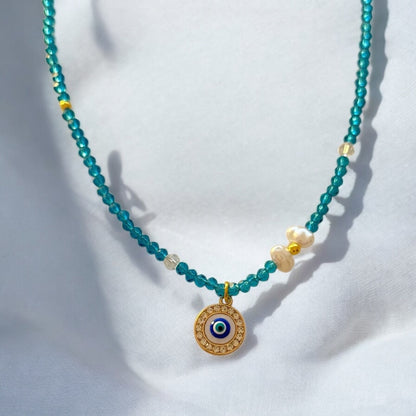 Necklace with blue beads and pendant eyes - ne429