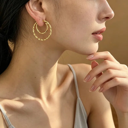 Doppelte Creolen aus Stahl und Gold – EA128