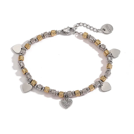 Gold and silver bracelet with hearts-br164