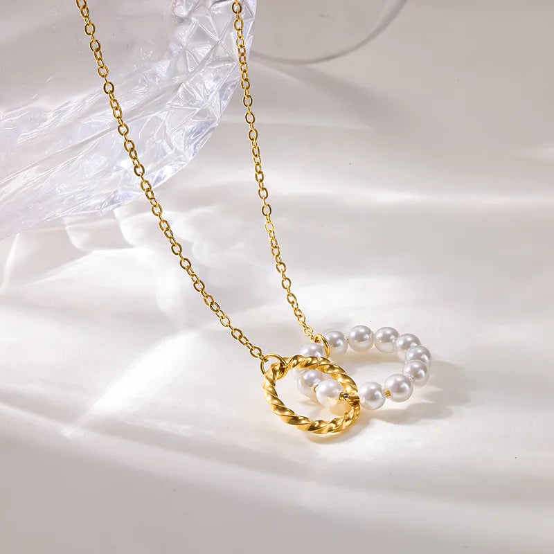 Steel necklace with pink zircon hearts - NE426