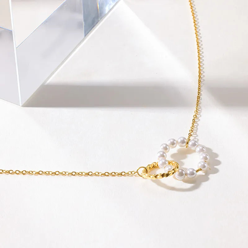 Steel necklace with pink zircon hearts - NE426