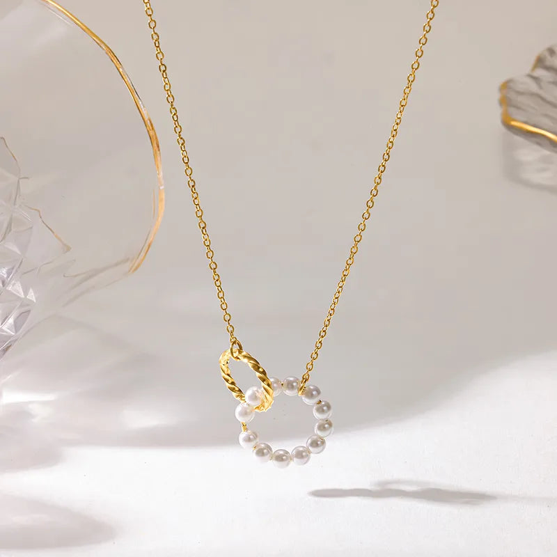 Steel necklace with pink zircon hearts - NE426