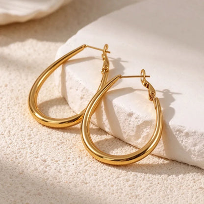 Goldene Stahlohrringe mit braunen Steinen – EA320