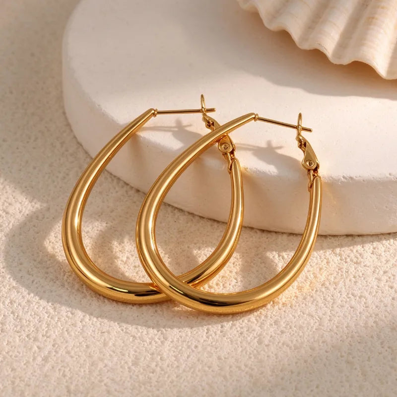 Goldene Stahlohrringe mit braunen Steinen – EA320