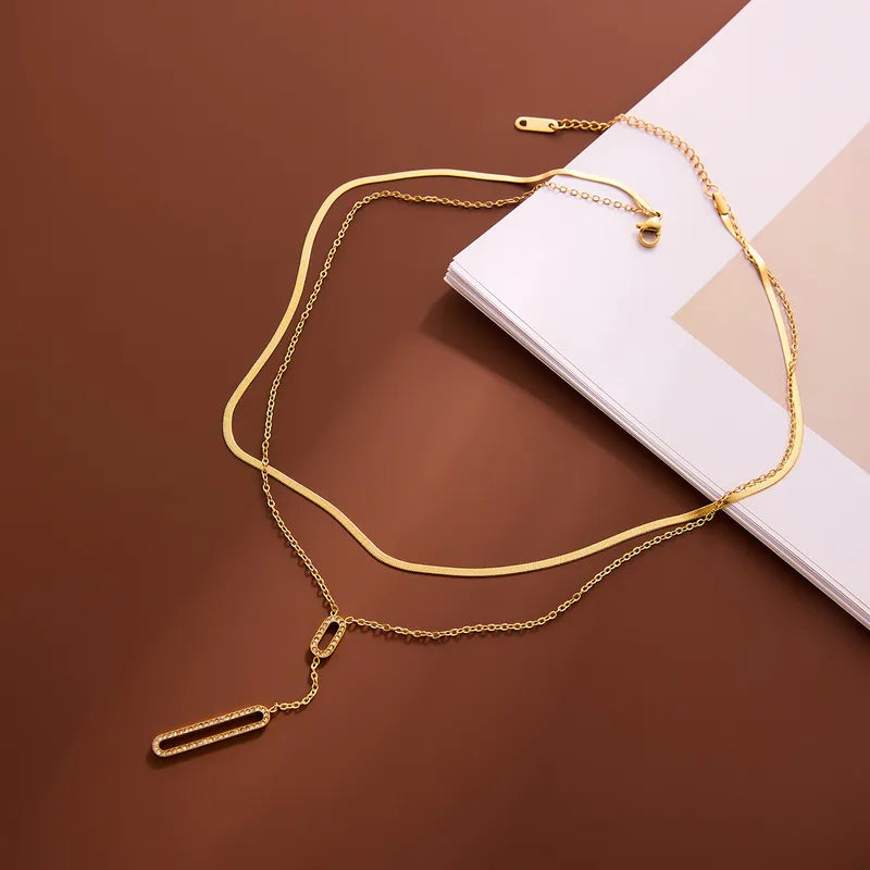 Collier double pendentif acier doré - NE783