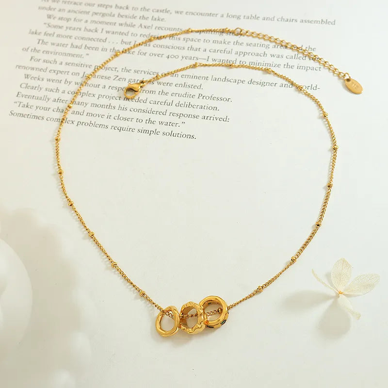 Κολιέ ατσάλινο με 3 δαχτυλίδια και zircon - NE570