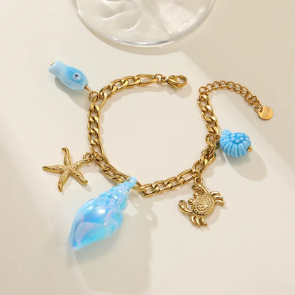 Βραχιόλι  ατσάλινο με γαλάζια και χρυσά charms  - BR429