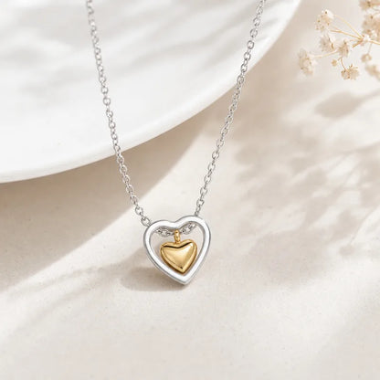 Collana in acciaio con cuore in oro e argento - NE545