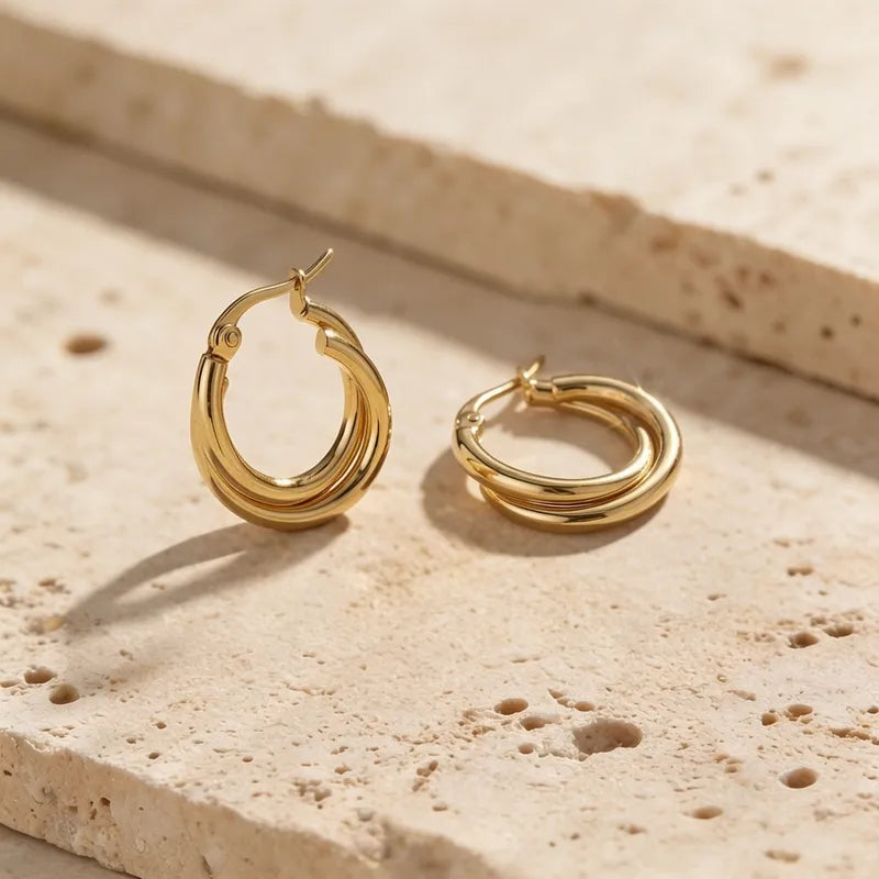 Goldene Stahlohrringe mit braunen Steinen – EA320