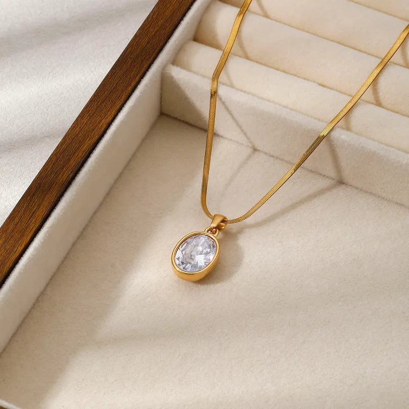 Collana in acciaio dorato con zircone ovale - NE402