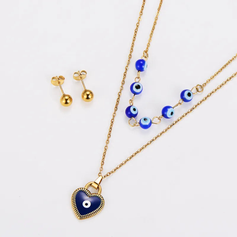 Steel set with blue eyes and earrings golden balls - SET068