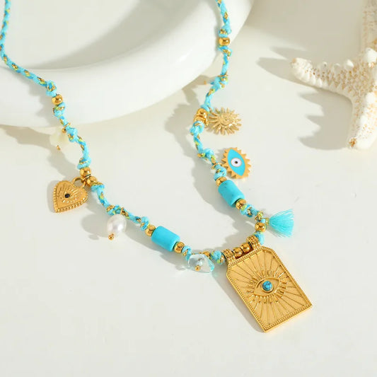 Necklace gilded steel with eye and turquoise details-