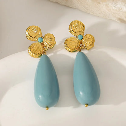 Orecchini conchiglia in acciaio bianco con perla - EA756
