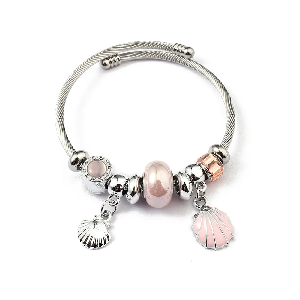 Βραχιόλι ατσάλινο με κοχύλι και ροζ charms -BR362