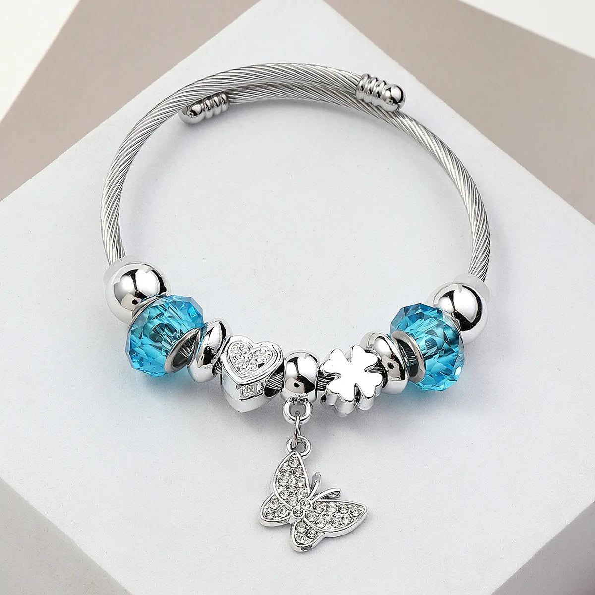 Βραχιόλι ατσάλι bangle με γαλάζια charms και πεταλούδα-BR300