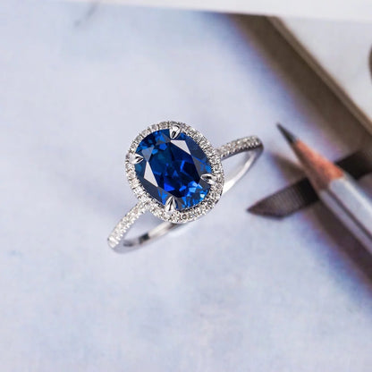 Ring with blue oval zircon - r027