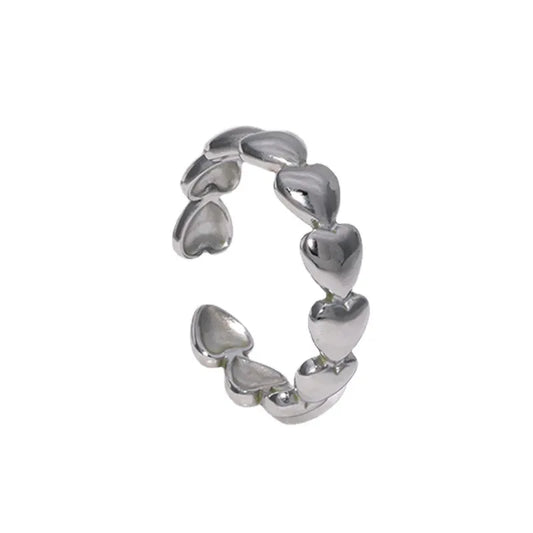 Steel ring with sideways silver hearts - R116